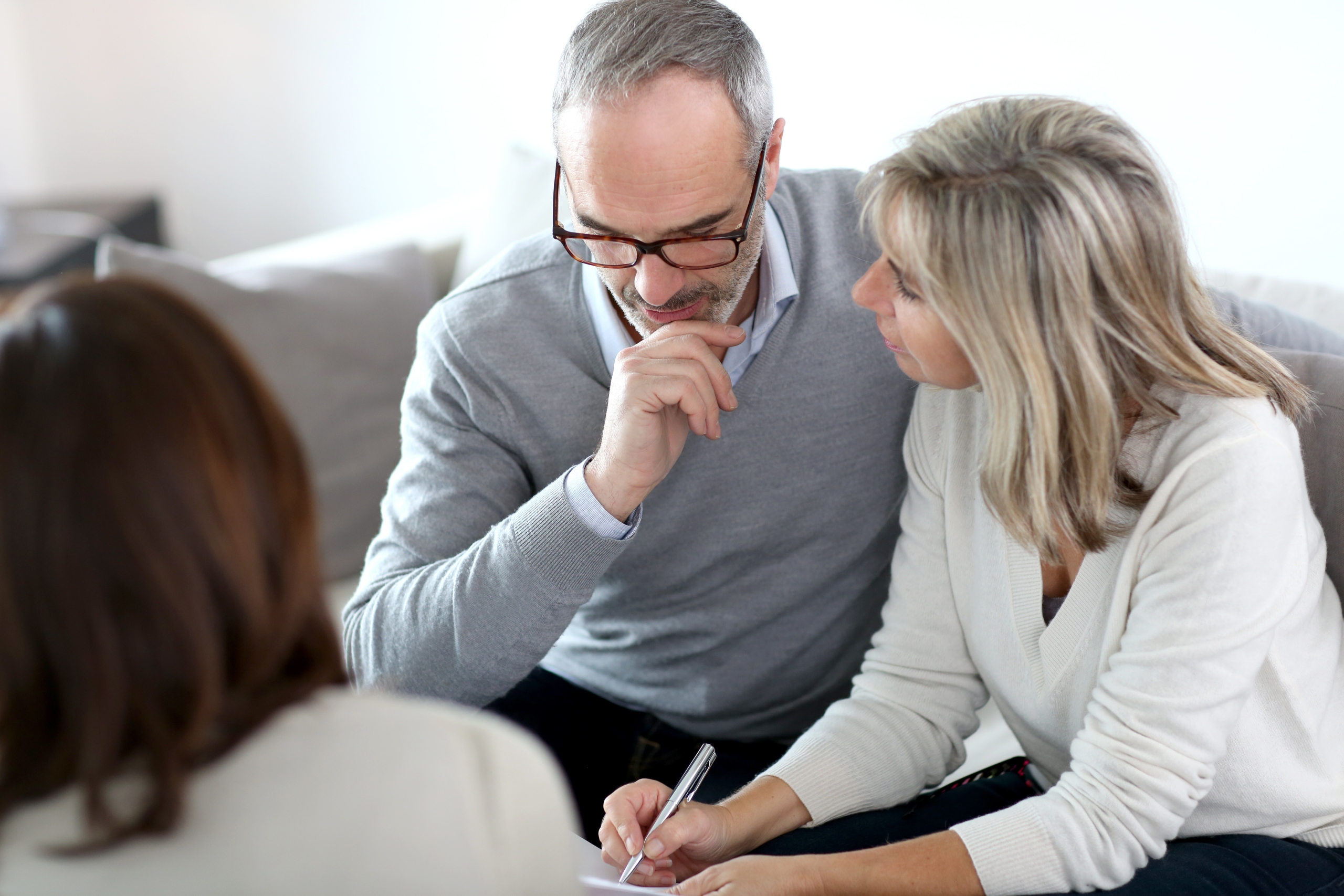 Senior couple meeting financial adviser for investment POA for over 50's