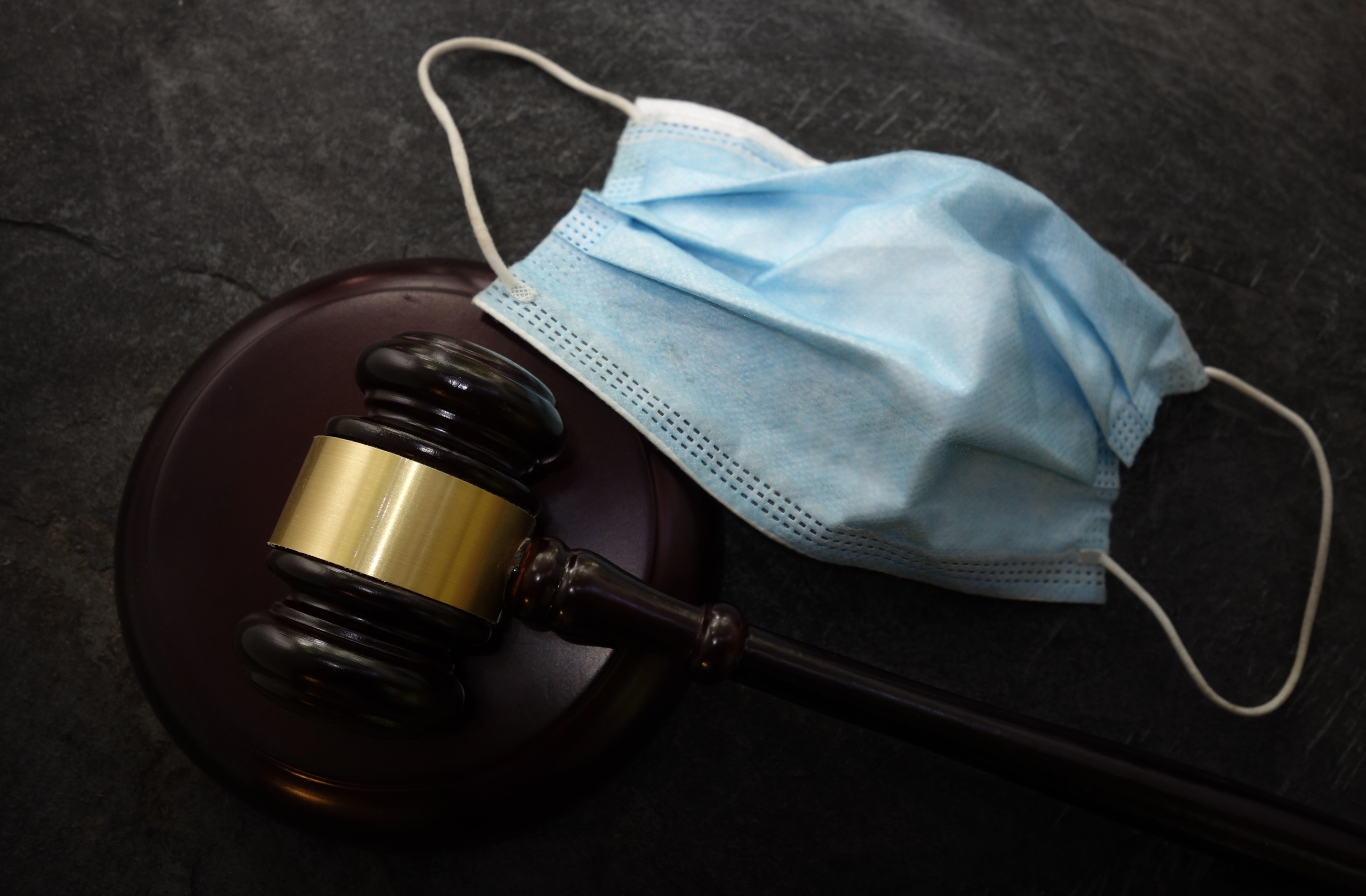 Court legal gavel and facemask -- Coronavirus mask mandate conce